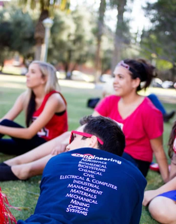 Univ of AZ, student seated lawn, smiling