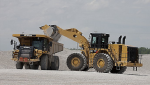 Two large pieces of Caterpillar construction equipment