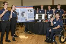 UA Engineering Design team students display their design project