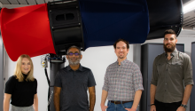 The UA Space Domain Awareness team - including Grace Halferty, Vishnu Reddy, Adam Battle and Tanner Campbell - stand in front of the RAPTORS-1 telescope on top of Kuiper Space Sciences Building.