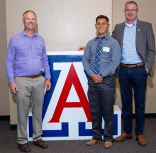 AME professor Eric Butcher, mechanical engineering outstanding graduate teaching assistant Fabian Medina, and Craig M. Berge Dean of the College of Engineering David W. Hahn