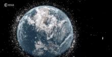 An animated rendering of Earth shows it in space, surrounded by debris.