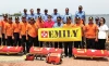 Anthony Mulligan (front row, center) trains members of the Indonesian National Ministry of Search and Rescue to use the EMILY (Emergency Integrated Lifesaving Lanyard) rescue craft in Jakarta.