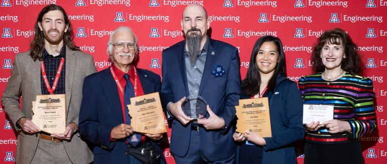 Vy Kieu and Zoe Draelos (two farthest right) with their awards at the 2023 Homecoming Engineers Breakfast. 