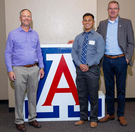 AME professor Eric Butcher, mechanical engineering outstanding graduate teaching assistant Fabian Medina, and Craig M. Berge Dean of the College of Engineering David W. Hahn