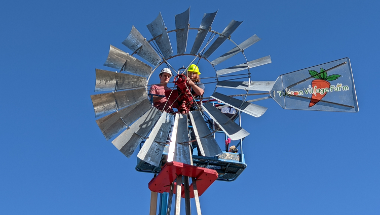 Michael Debbins and Shane Lawler at work on the Tucson Village Farm windmill
