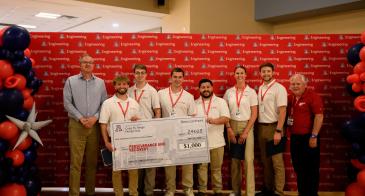 Aerospace and mechanical engineering students in the College of Engineering are presented an award at Design Day.