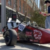 Aerospace and mechanical engineering junior Cooper Graf stands beside the Wildcat Formula Racing club's WF25 vehicle on the University of Arizona campus.
